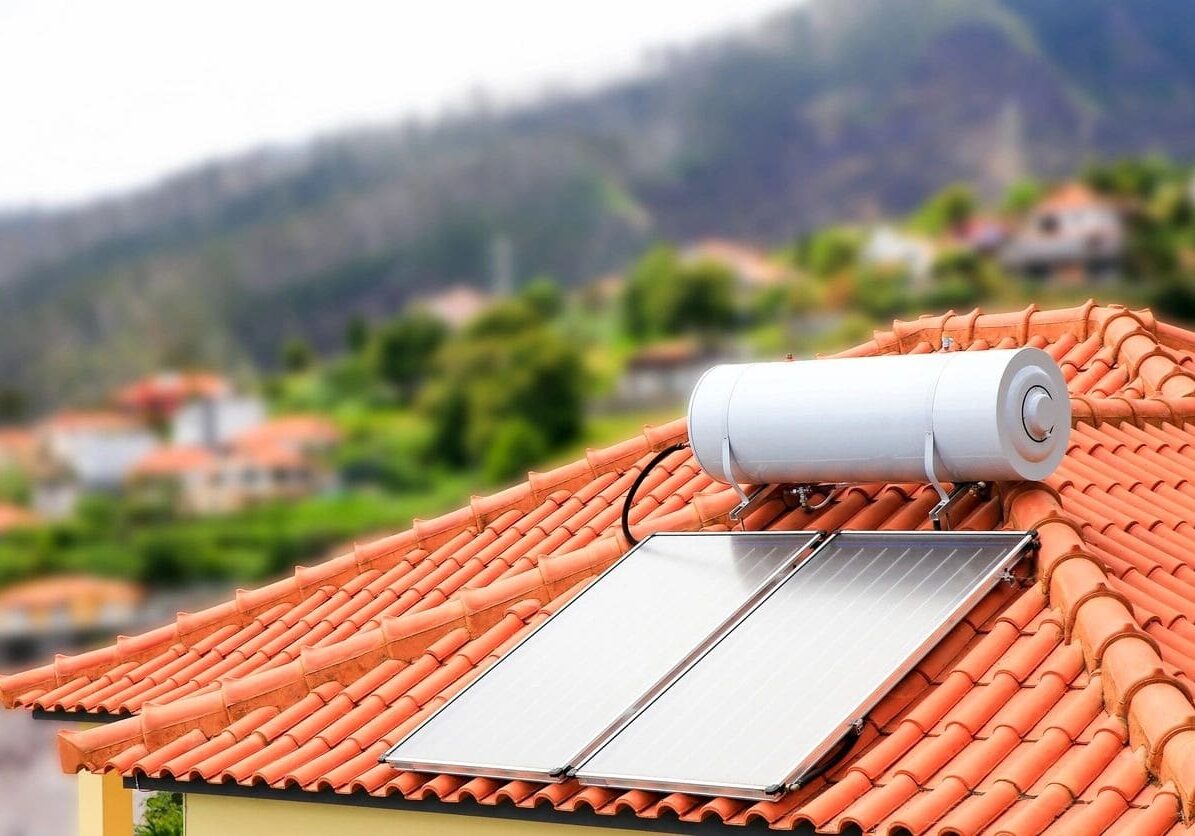 A solar water heater on the roof of a house.